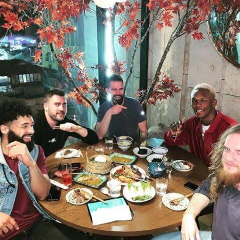 Israel Adesanya with his friends.